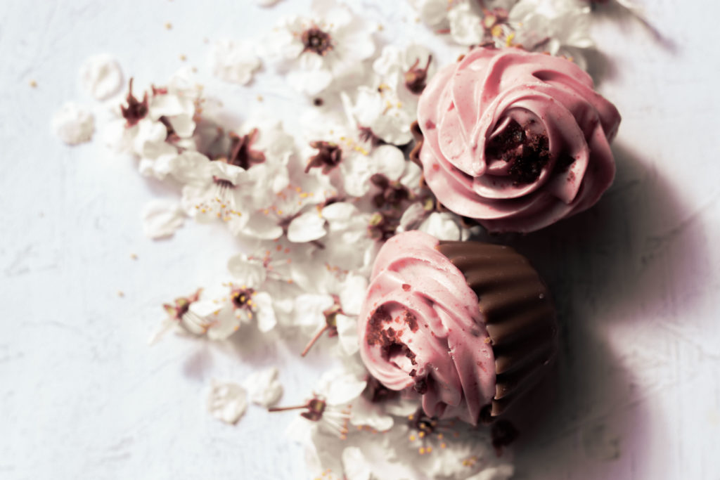 cupcakes on a bed of white cherryflowers, boho-style